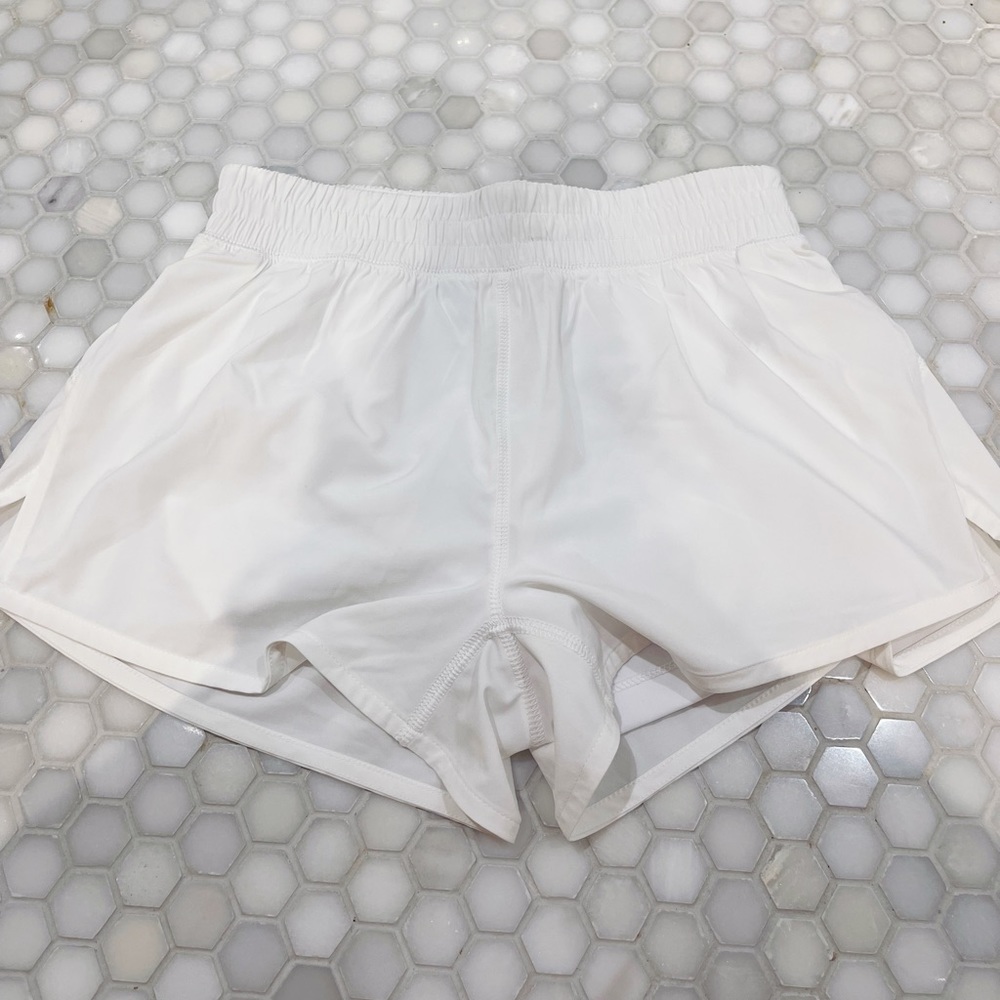 Aritzia TNA white workout shorts